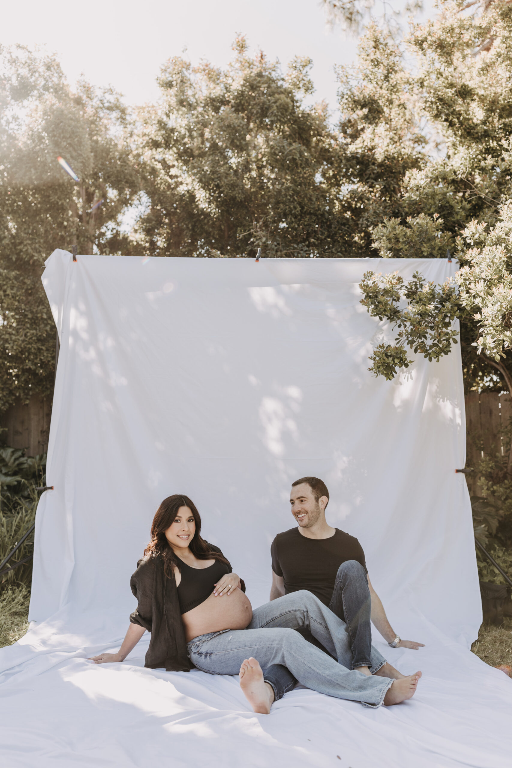 backyard mini maternity session maternity photos white backdrop sabrinalynnphoto San Diego couples photographer florals