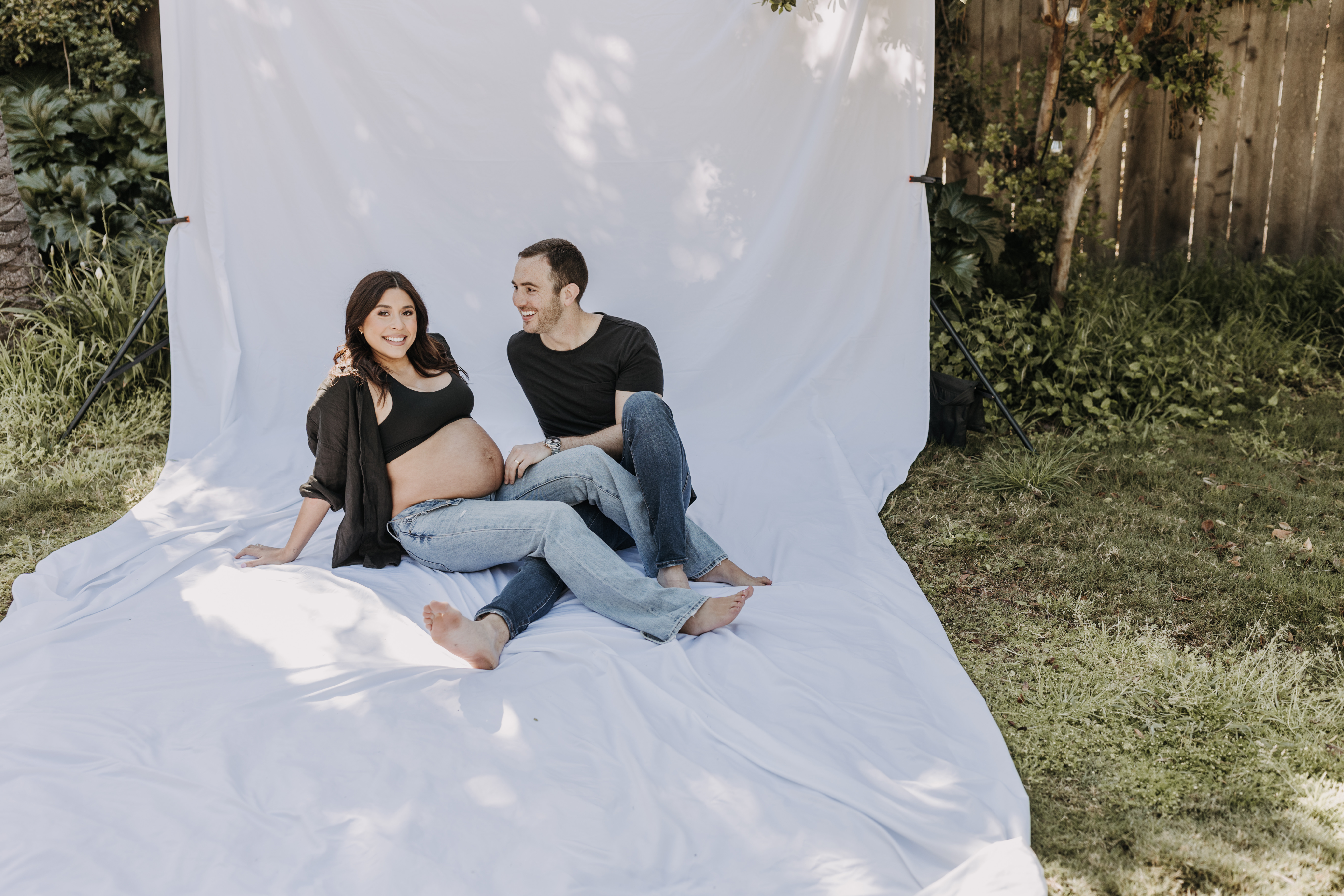 backyard mini maternity session maternity photos white backdrop sabrinalynnphoto San Diego couples photographer florals 