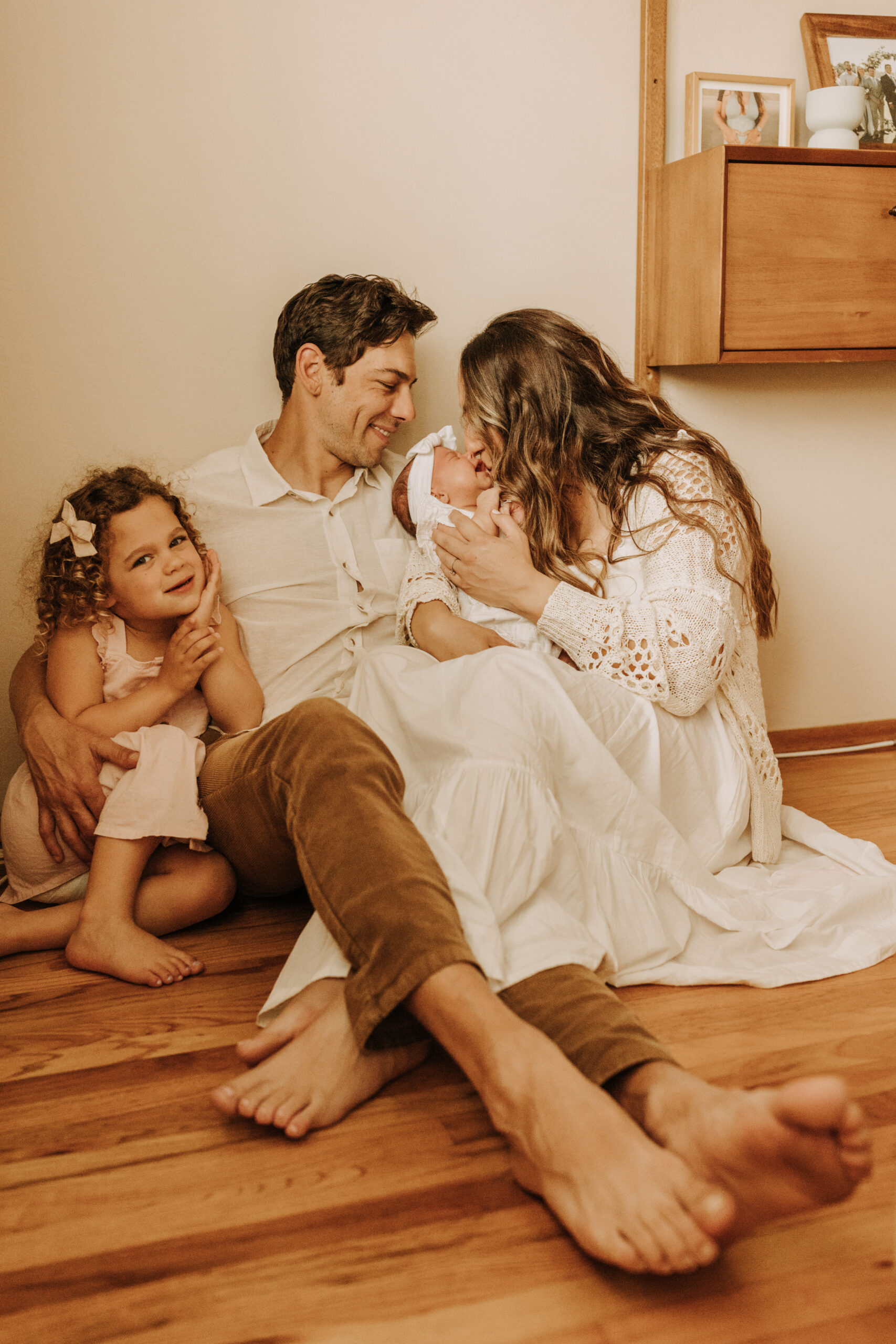 warm and cozy in home family session newborn photos newborn baby infant photos candid family moments neutral toned in home family of four San Diego family photographer Sabrina kinsella sabrinalynnphoto