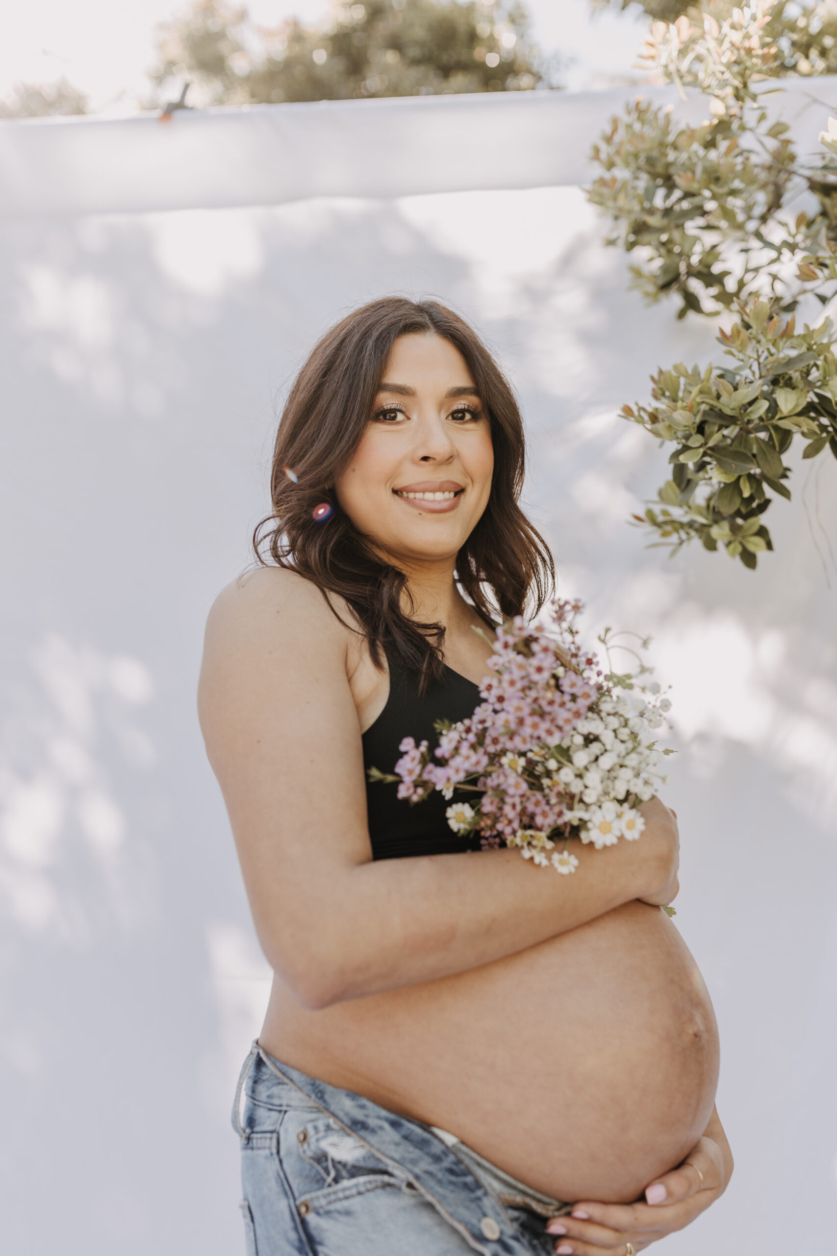 backyard mini maternity session maternity photos white backdrop sabrinalynnphoto San Diego couples photographer florals