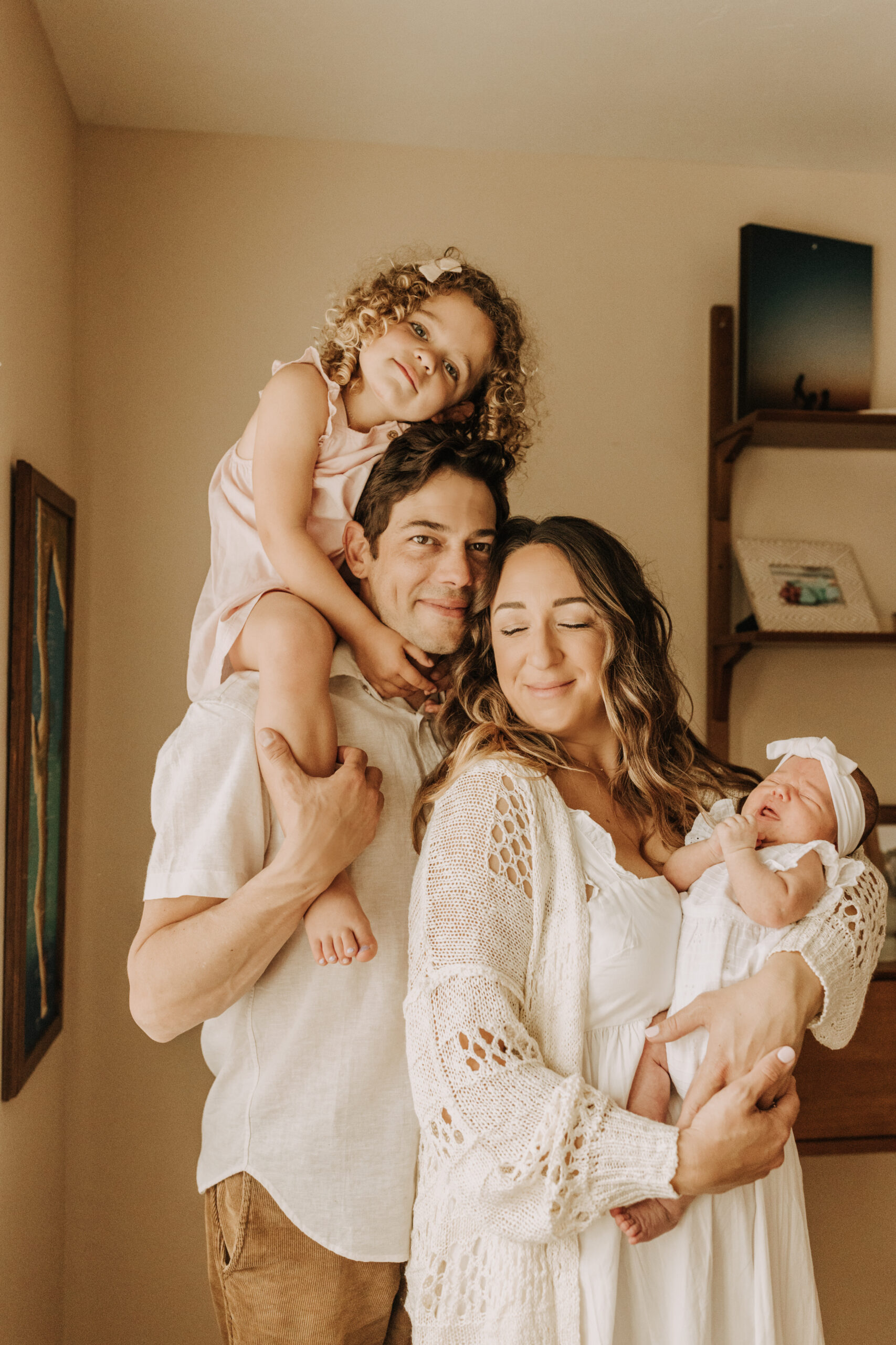 warm and cozy in home family session newborn photos newborn baby infant photos candid family moments neutral toned in home family of four San Diego family photographer Sabrina kinsella sabrinalynnphoto