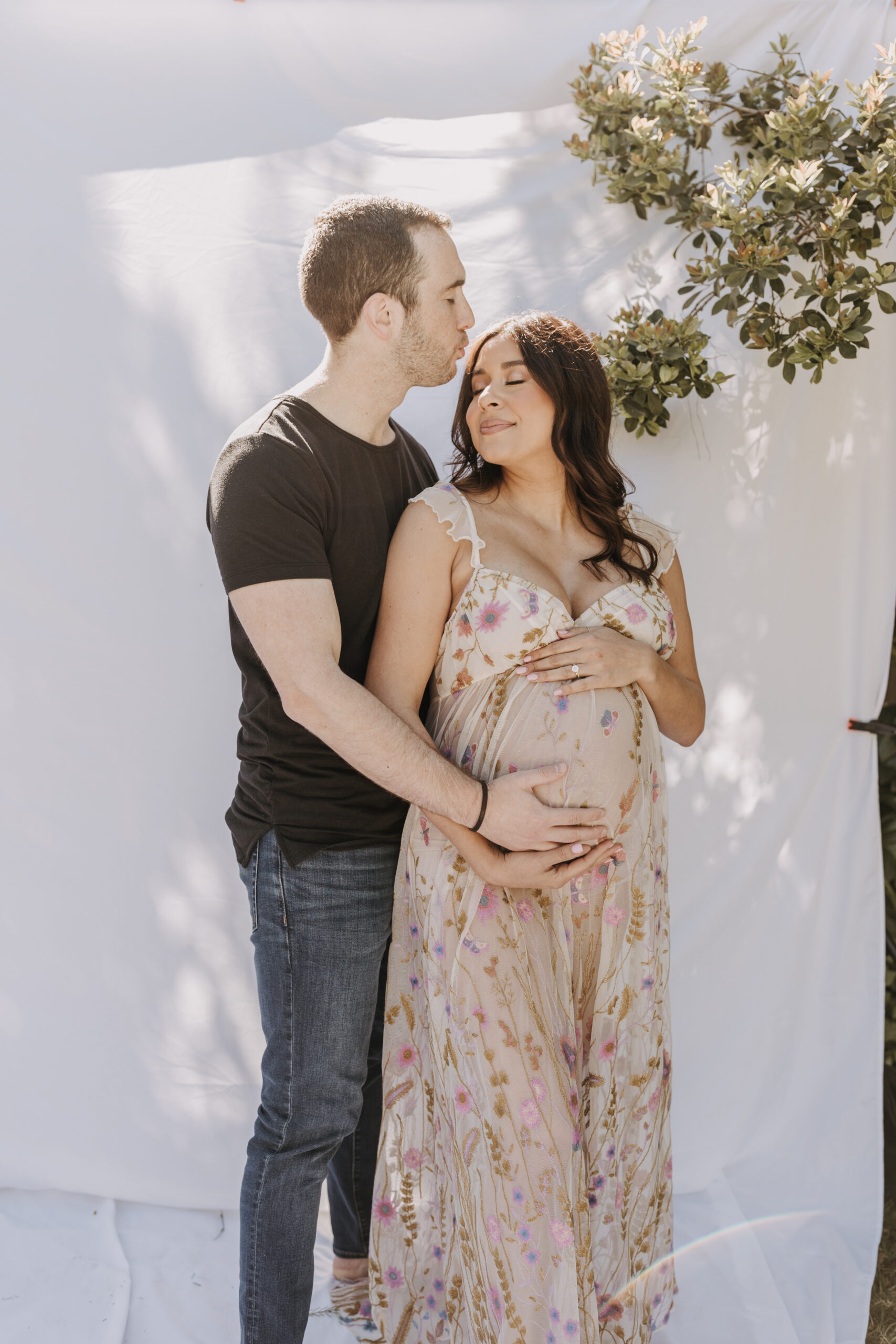 backyard mini maternity session maternity photos white backdrop sabrinalynnphoto San Diego couples photographer florals