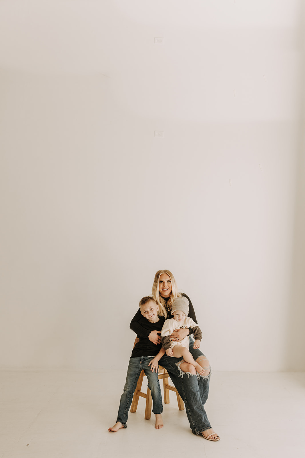 family session warm candid family photos motherhood moments mommy and me studio session neutral gallery San Diego family photographer Sabrina kinsella mom of two boys