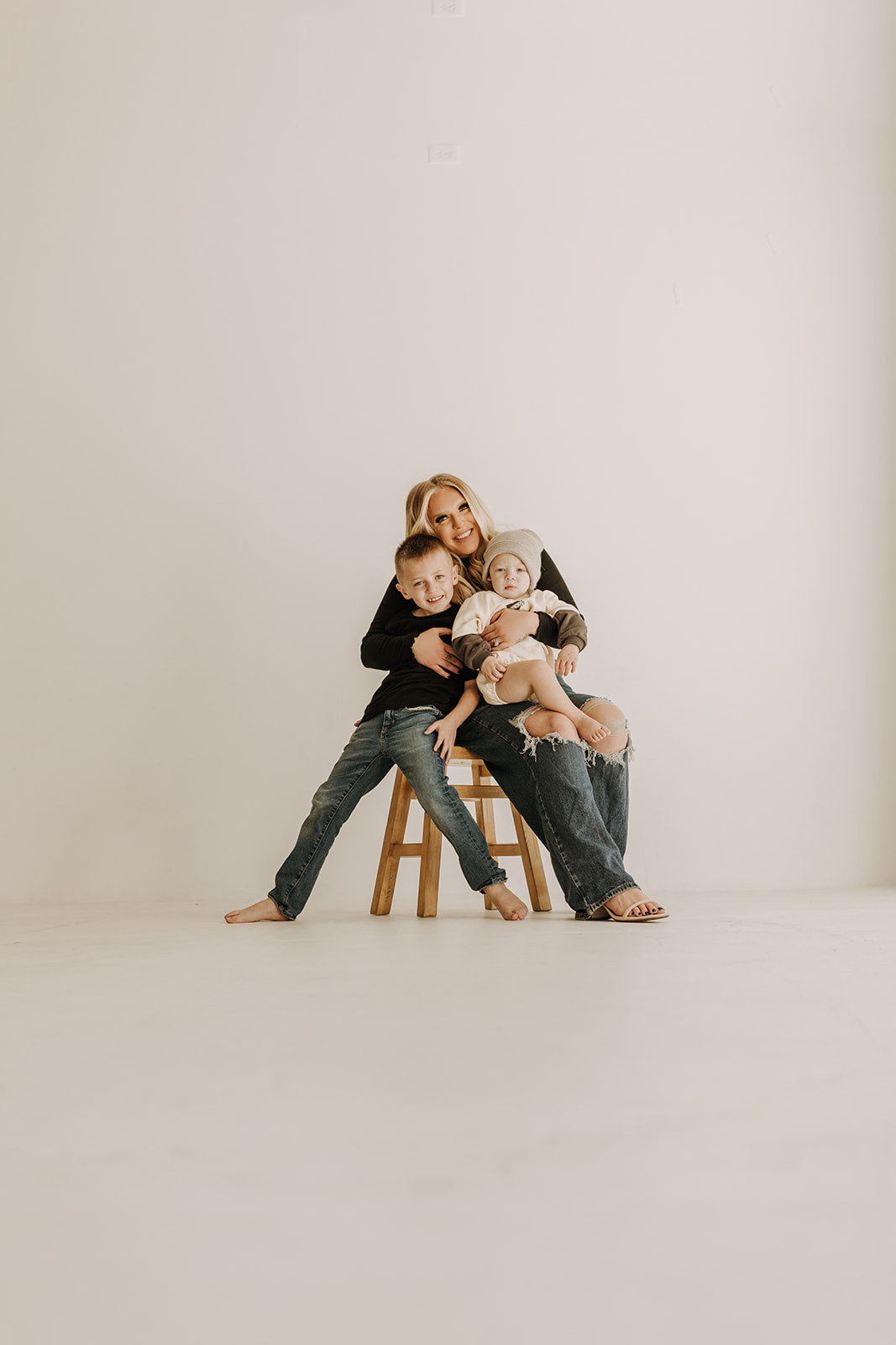 family session warm candid family photos motherhood moments mommy and me studio session neutral gallery San Diego family photographer Sabrina kinsella mom of two boys 