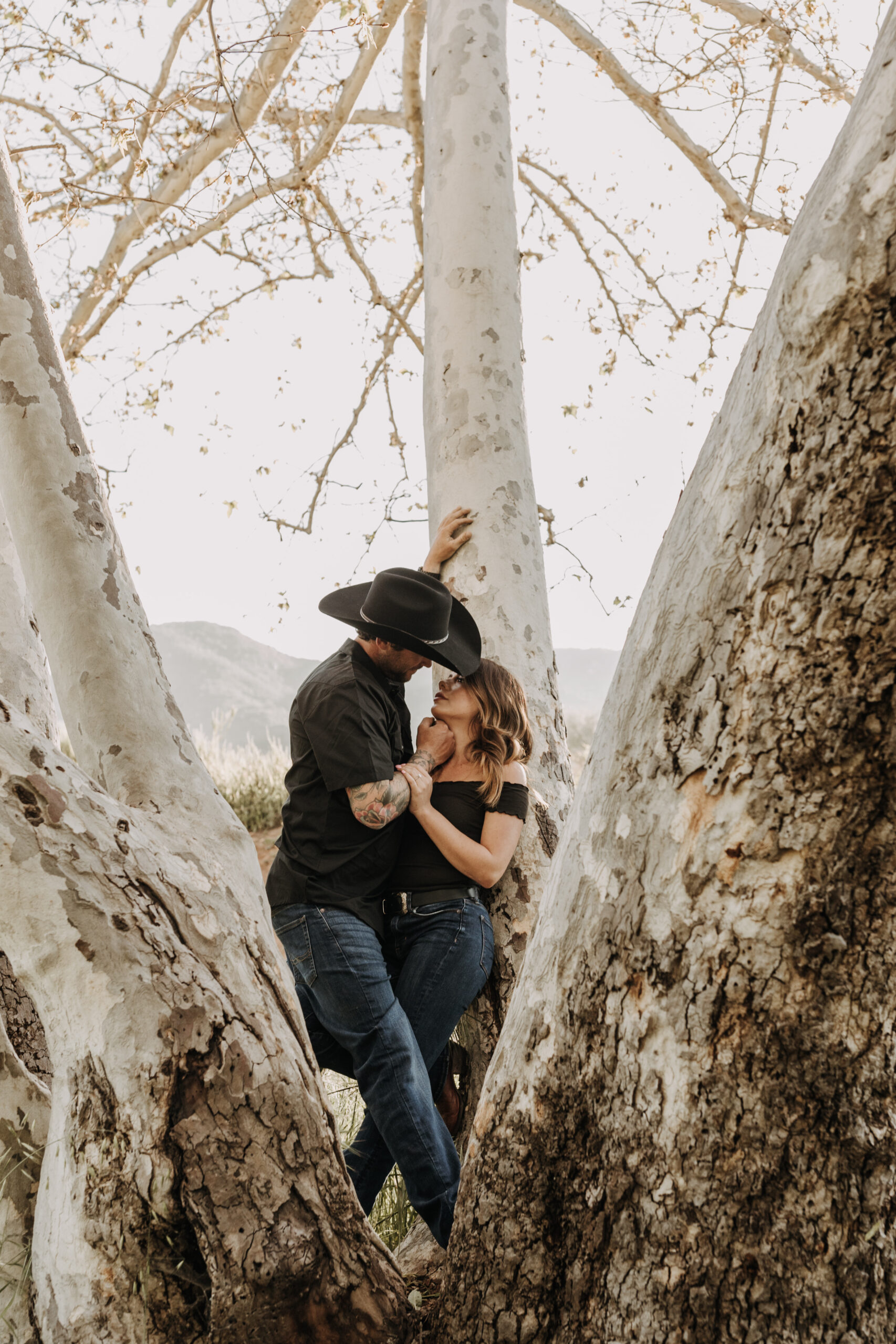 outdoor western romantic engagement session couples photography warm toned country cowboy modern couple bride and groom engagement San Diego couples photographer Sabrina kinsella sabrinalynnphoto