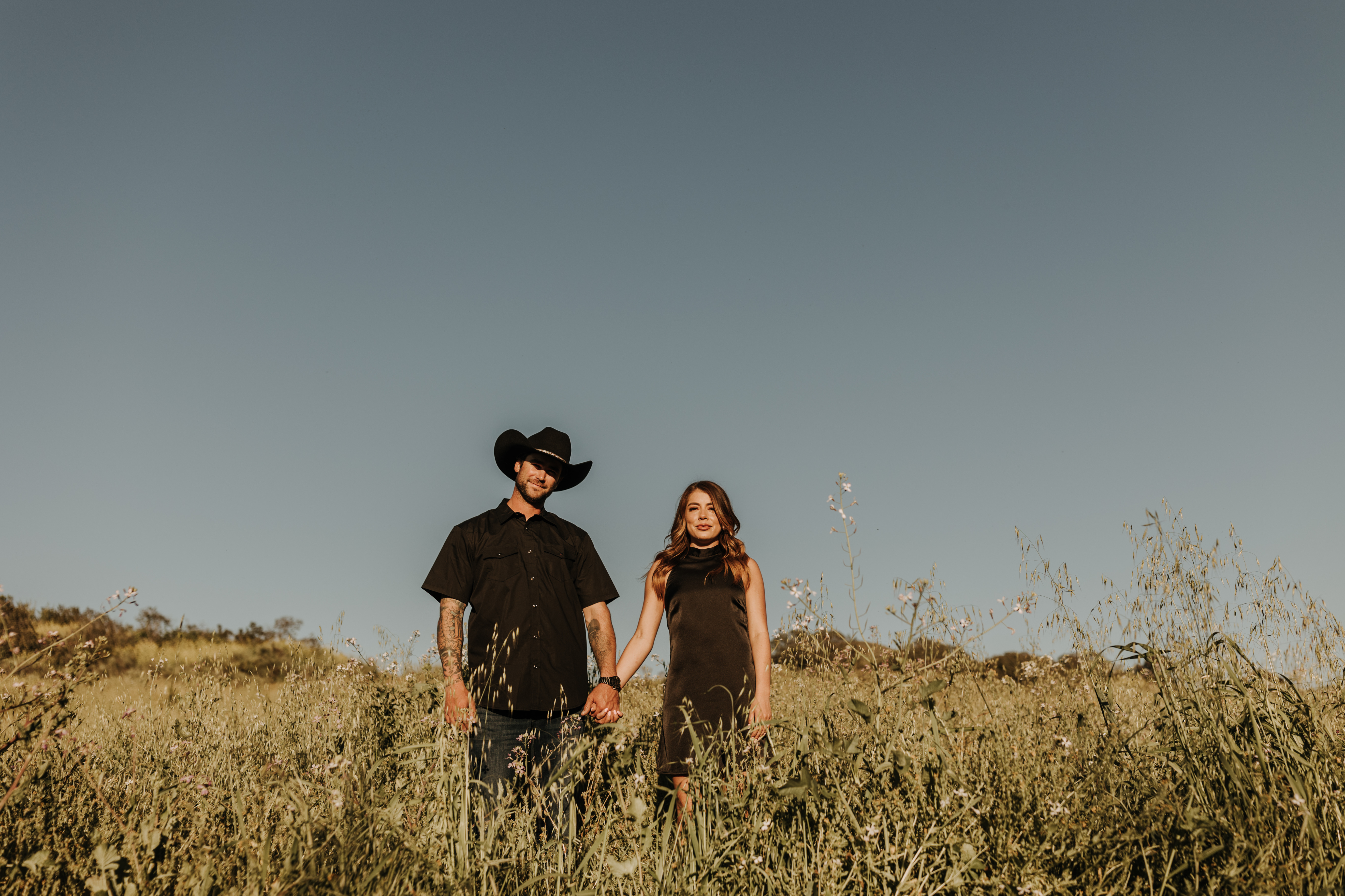 outdoor western romantic engagement session couples photography warm toned country cowboy modern couple bride and groom engagement San Diego couples photographer Sabrina kinsella sabrinalynnphoto