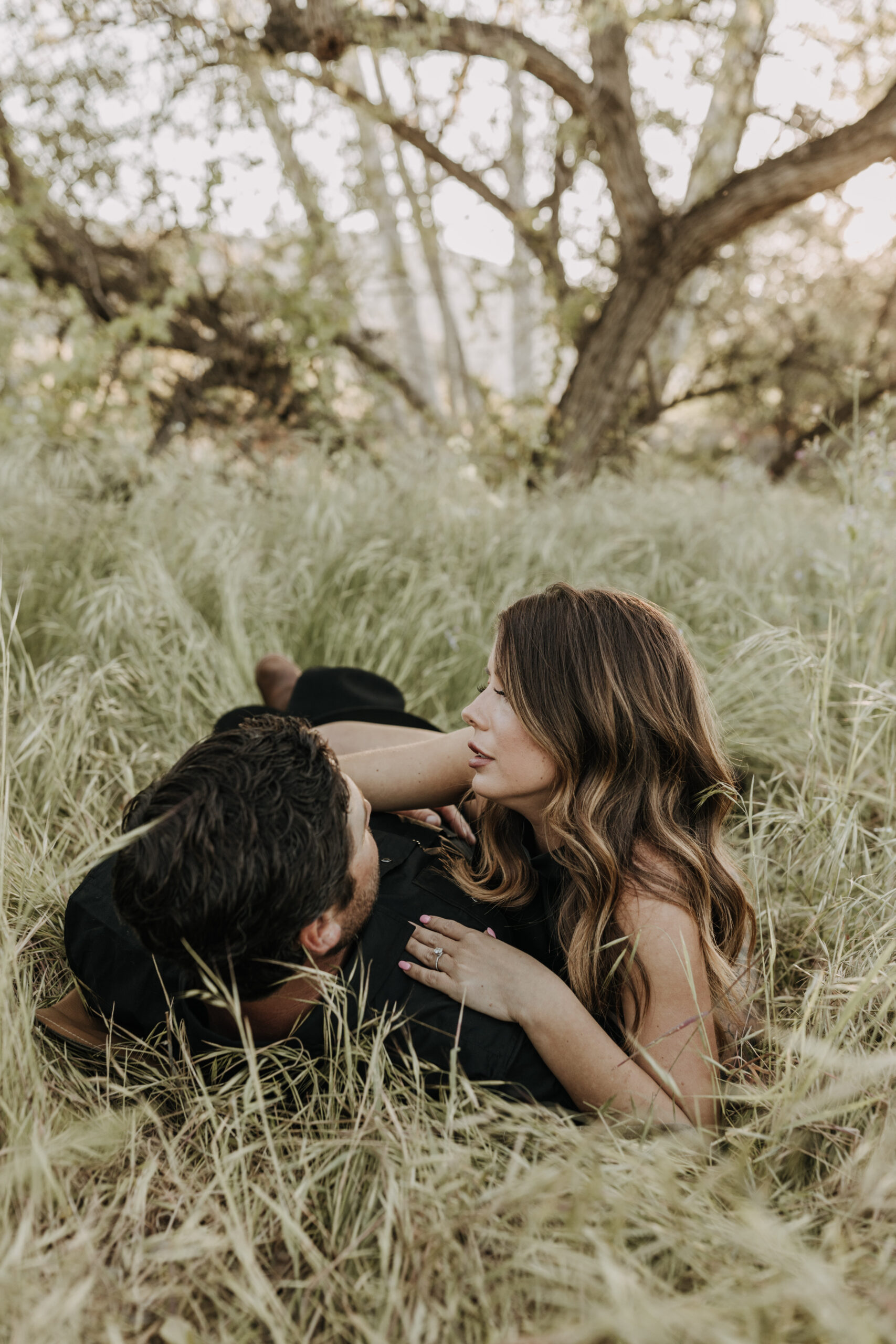 outdoor western romantic engagement session couples photography warm toned country cowboy modern couple bride and groom engagement San Diego couples photographer Sabrina kinsella sabrinalynnphoto