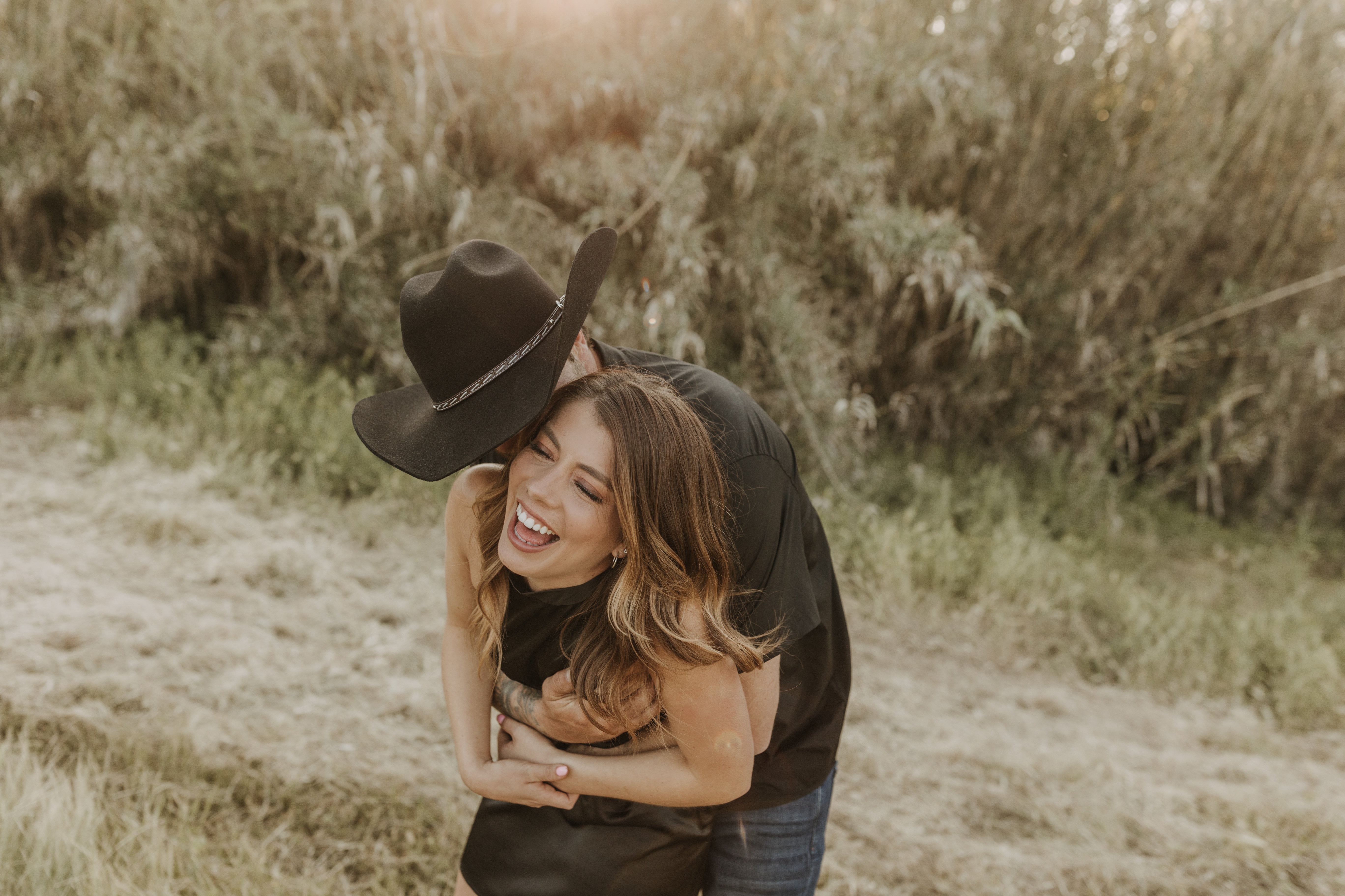 outdoor western romantic engagement session couples photography warm toned country cowboy modern couple bride and groom engagement San Diego couples photographer Sabrina kinsella sabrinalynnphoto