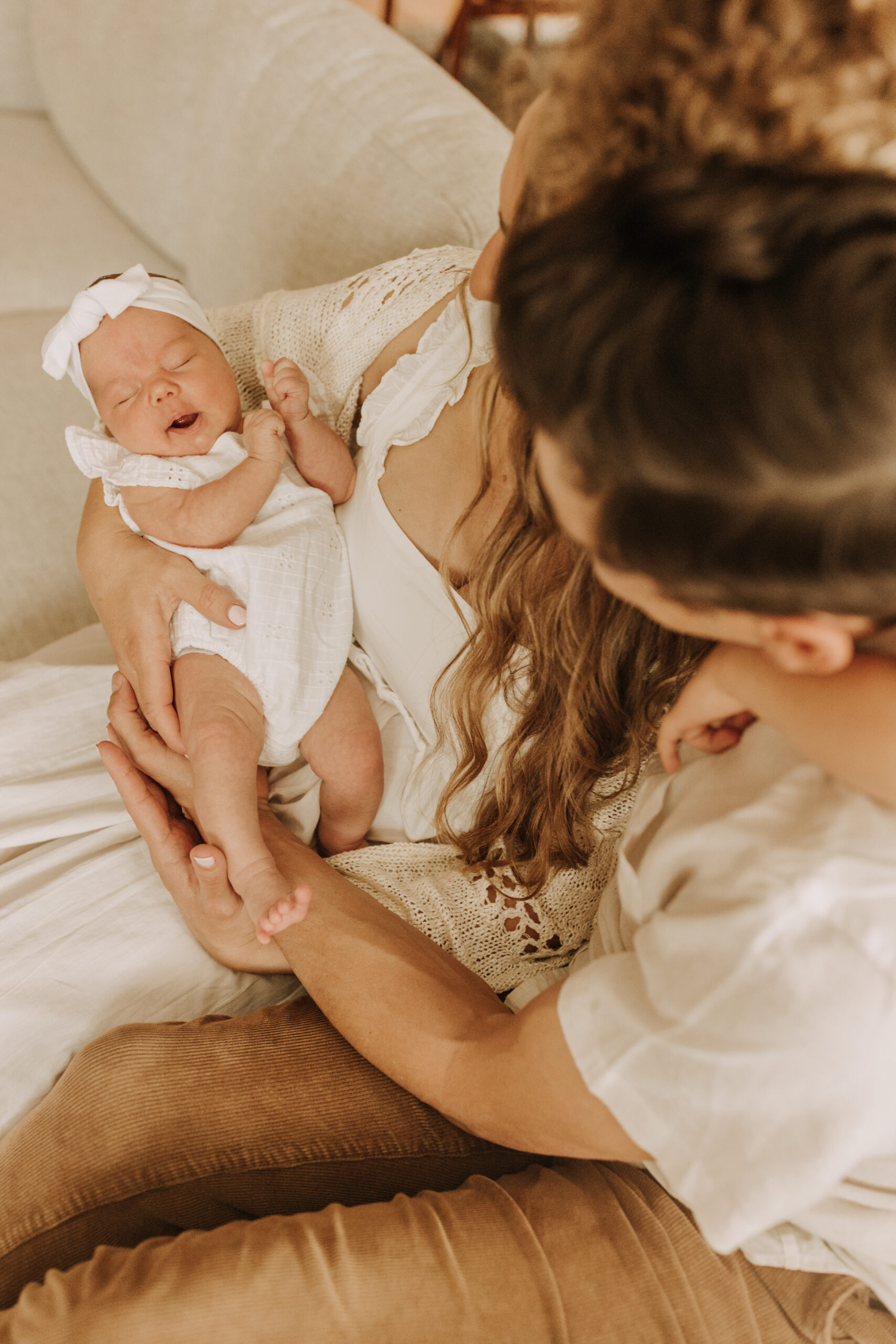 warm and cozy in home family session newborn photos newborn baby infant photos candid family moments neutral toned in home family of four San Diego family photographer Sabrina kinsella sabrinalynnphoto