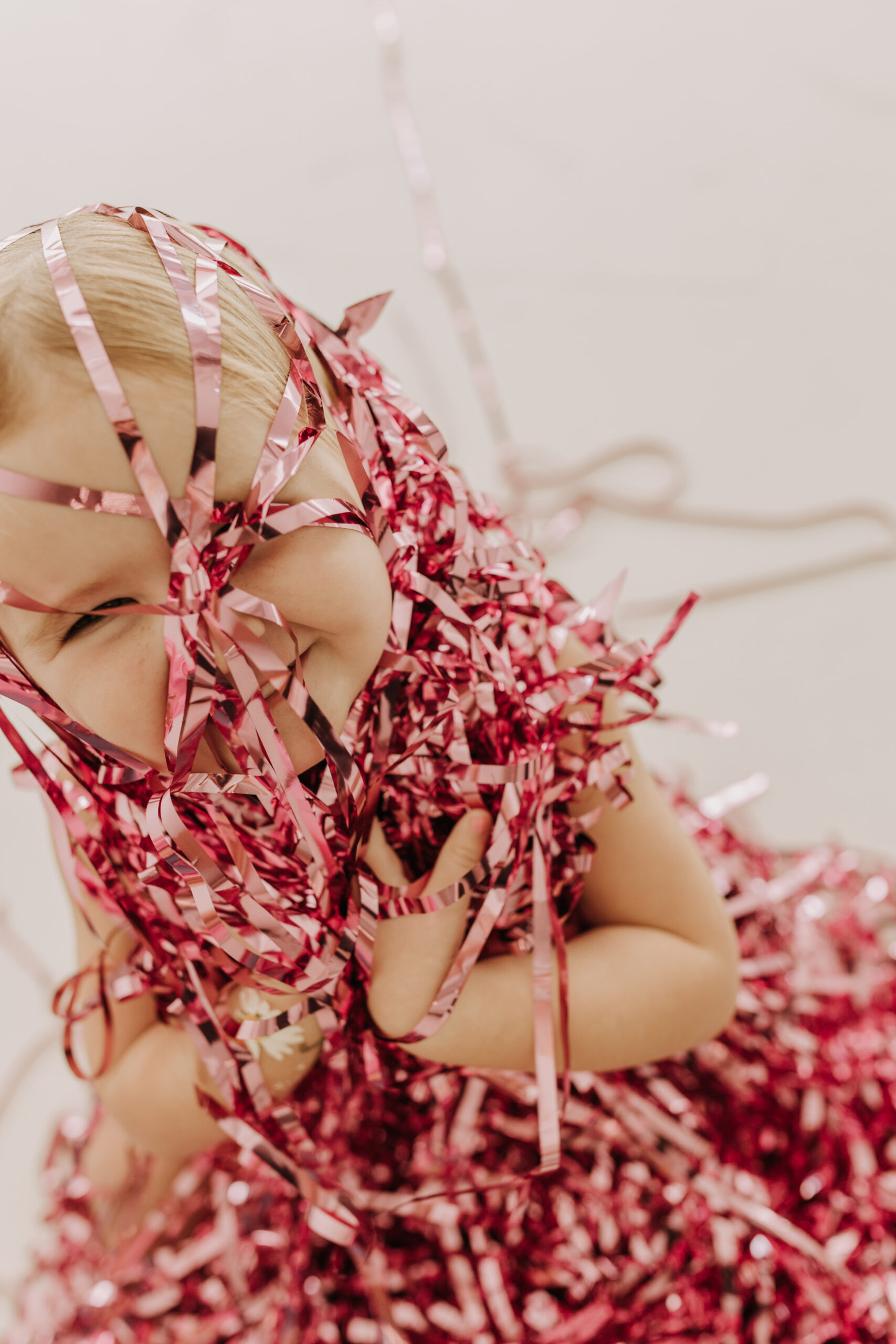 studio photography session pink maternity photos in a studio white backdrop pink confetti streamers mama and me motherhood mini sessions family photos candid maternity photos styled shoot San Diego maternity photographer Sabrinalynnphoto Sabrina kinsella