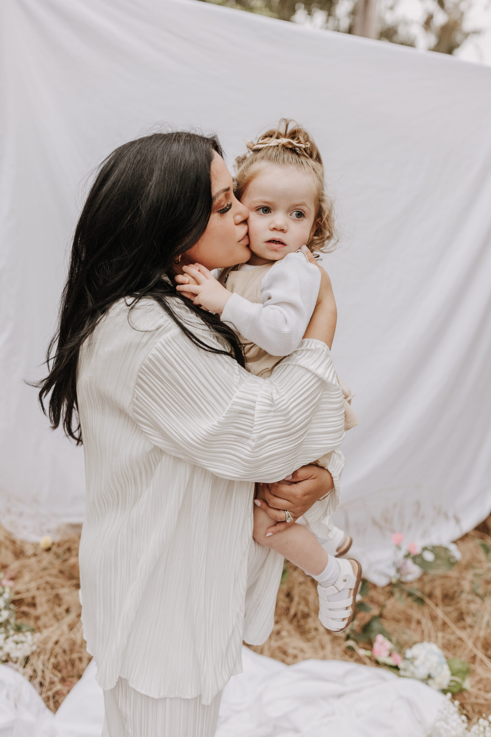 backyard mini maternity styled shoot San Diego family photographer neutral toned maternity photos candid outdoor family photos