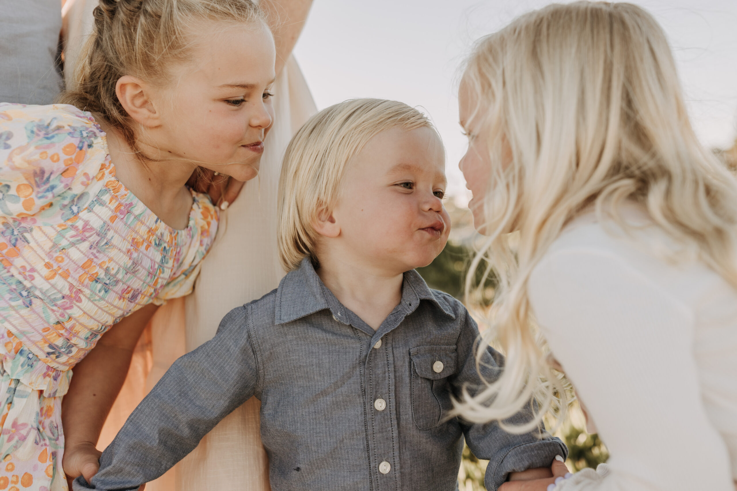 beach family photos sunset golden hour candid family photos family of four at sunset on the beach san Diego family photographer Sabrina kinsella sabrinalynnphoto