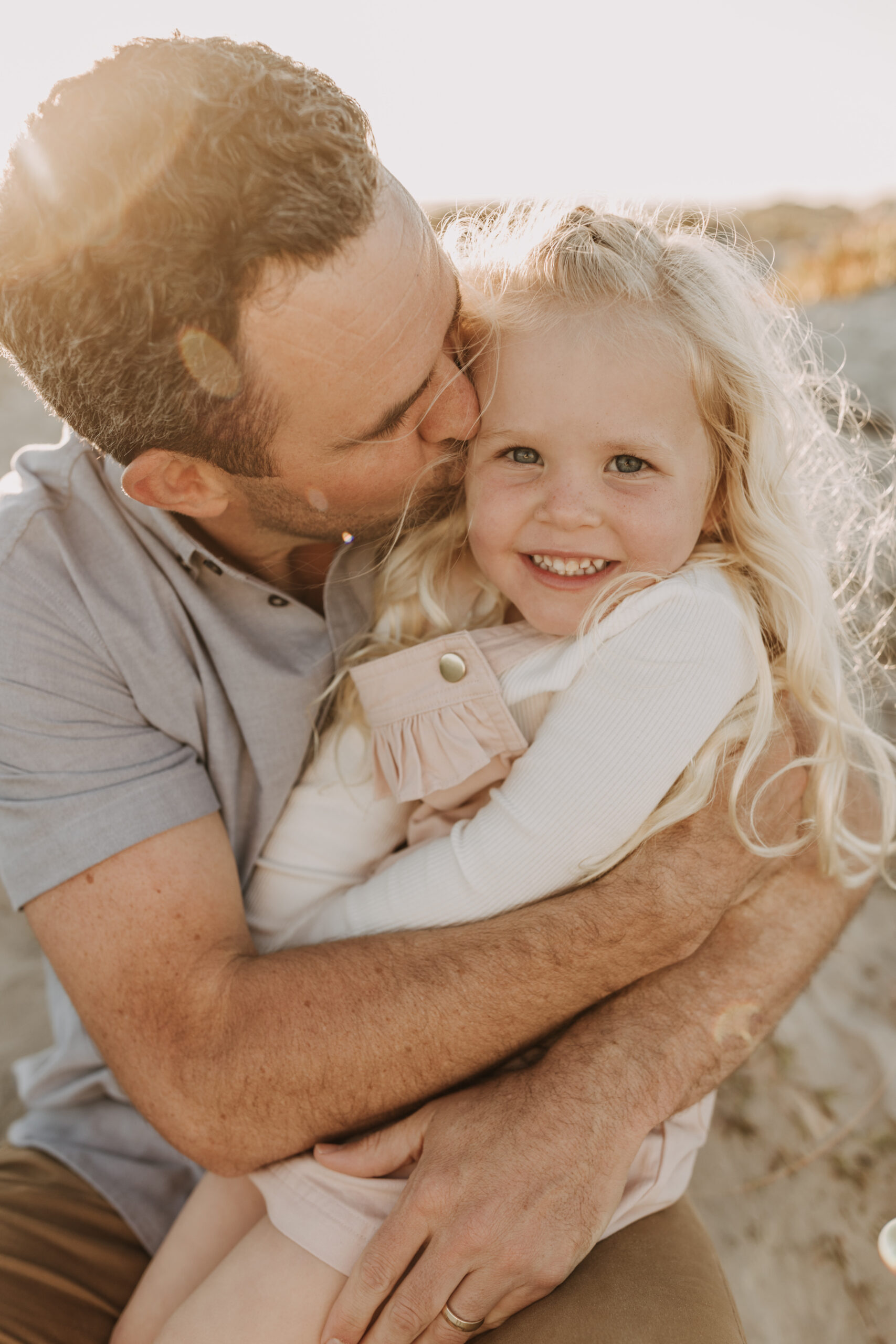 beach family photos sunset golden hour candid family photos family of four at sunset on the beach san Diego family photographer Sabrina kinsella sabrinalynnphoto