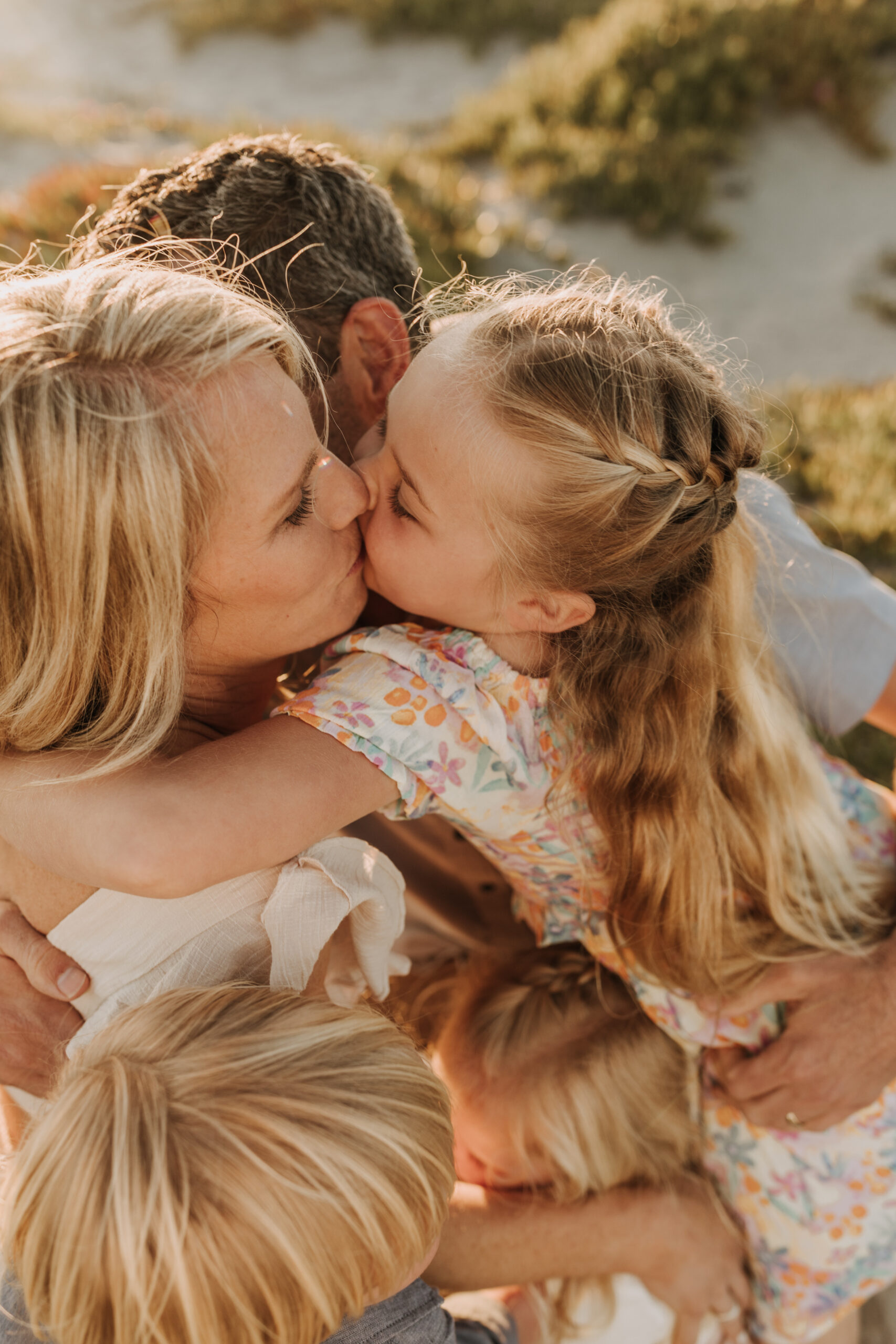 beach family photos sunset golden hour candid family photos family of four at sunset on the beach san Diego family photographer Sabrina kinsella sabrinalynnphoto