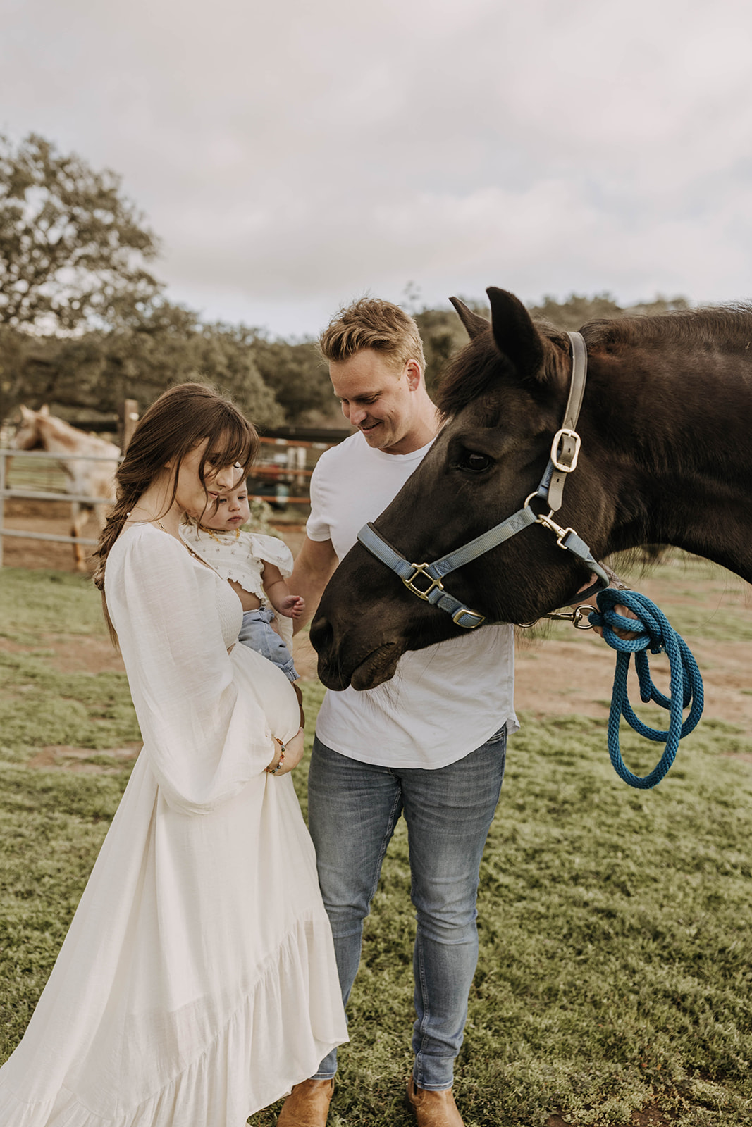 family maternity photoshoot with a horse