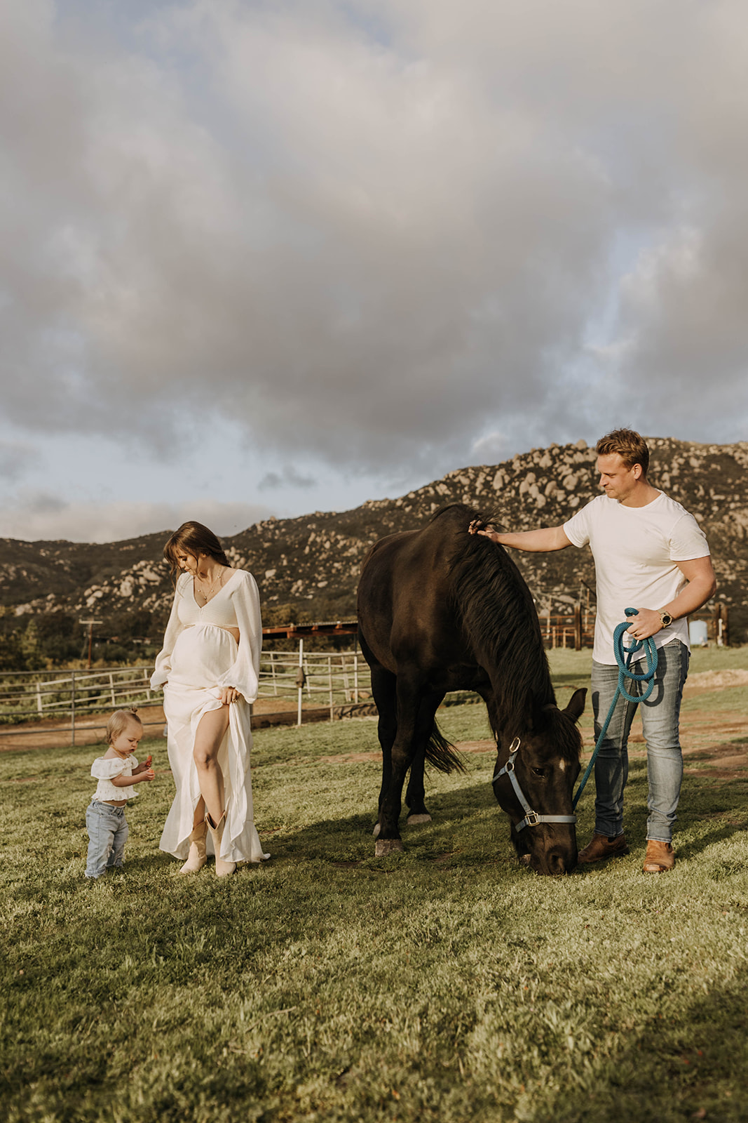 family maternity photoshoot with a horse