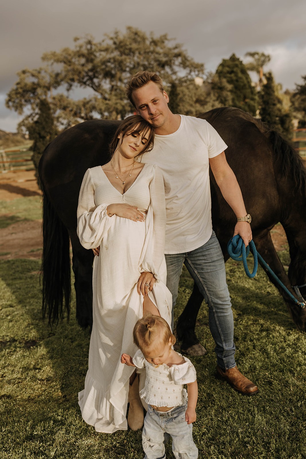 family maternity photoshoot with a horse